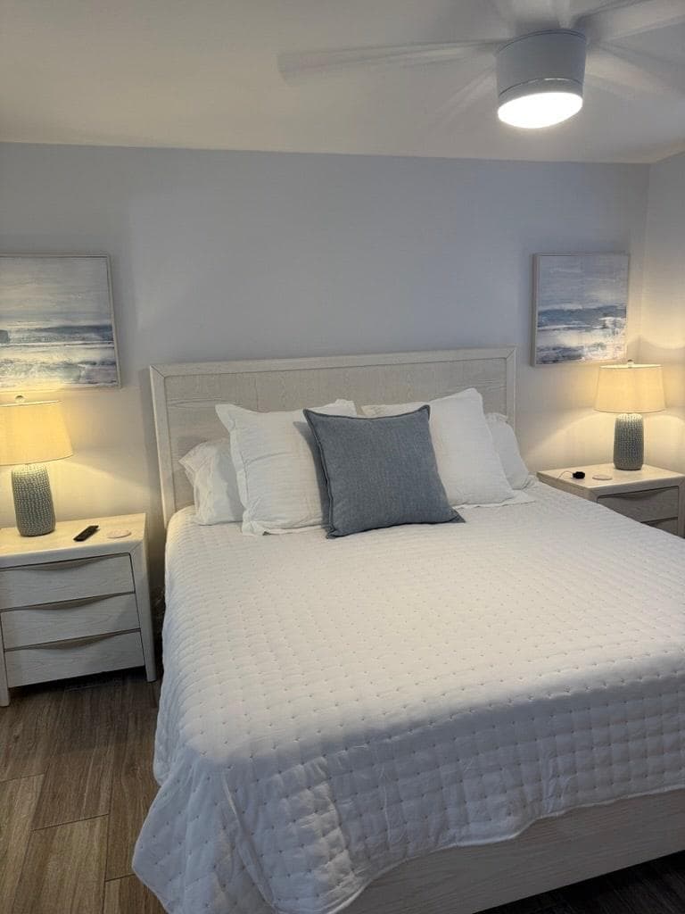 Master bedroom includes king size bed, large dresser, night stands, ceiling fans, 65" television and work space